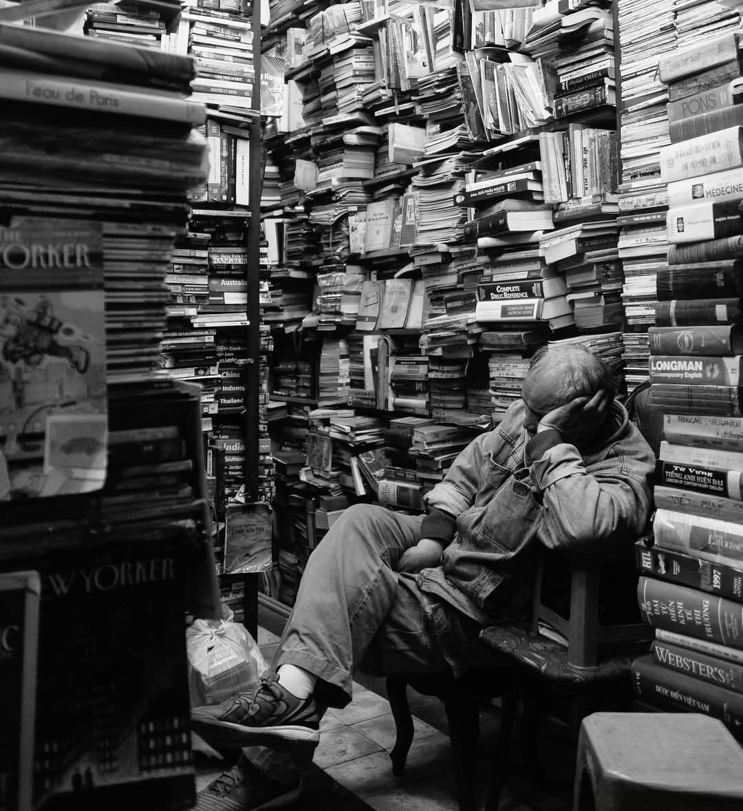 Man surrounded by books